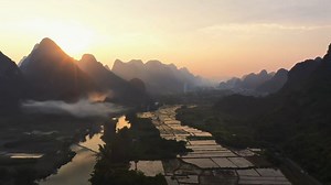 5.8K views · 18 reactions | #SceneryinGL Witness a panorama that stretches beyond imagination: unending mountain ranges, a sinuous river, a dense morning fog. Blessed by the morning sun, it transforms into a masterpiece, as if from the delicate brush of a Chinese ink painter. Bask in the majesty of this artwork, and let it stir your soul. | Go Guilin | Facebook