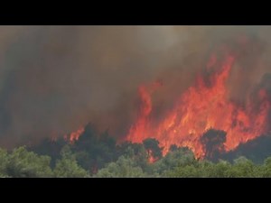Greek residents abandon homes as wildfires near