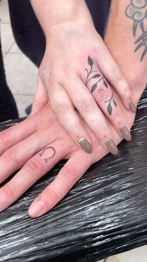 Congrats to @jordshugs and @dynamo_devvers on their engagement and upcoming wedding.. They had these wedding finger tattoos done by Naresh @tatuguru We love LOVE!! We also loved doing them for you both. Thanks so much ❤️ 🙏🏻❤️ CALL US FOR ENQUIRIES ON 0207 267 7888 #nareshflamineight #fingertattoos #weddingtattoo #omegatattoo #vinetattoo #fingertattoo #fingervinetattoo #fingerdots #fingerdottattoo #blackinktattoo #blackworktattoo #symboltattoo #jobstopper #smalltattoo #lovetattoo @eternalink @a