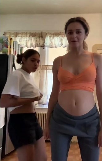 Two girls stuffed belly rolling with huge bellies