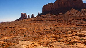 Rocky desert scene with massive cliffs and dry terrain