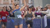 Slow Motion Portrait of Athletic Female Jogger Crossing the Finish...