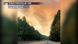 This footage shows smoke from the Milepost 97 fire rising above Interstate 5, close to Canyonville, on Friday and obscuring the road ahead. Sections of I-5 were closed on Saturday. | WeatherNation