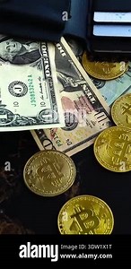 Silver Bitcoin Coin, BTC and Bills of Dollars are Rotating