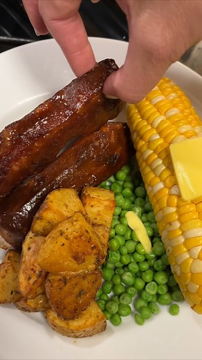 Easy oven baked bbq ribs for family dinner Add 1 onion halved, 6 cloves garlic smashed, salt and pepper to a large pot of boiling water. Boil ribs for 50 minutes to tenderize (I used 3 racks). Add ribs to parchment lined baking sheet, brush with bbq sauce, bake on 350F for 20 minutes. Microwave 3 tbsp melted butter, 2 tbsp brown sugar and more bbq sauce. Brush on ribs. Broil ribs on high until brown and crispy (about 5 minutes). | Sarah Bonds