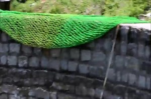 Residents of an Indian village join forces to rescue a leopard from a well.