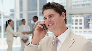 Handsome Businessman On Cellphone Office Lobby: วิดีโอสต็อก (ปลอดค่าลิขสิทธิ์ 100%) 925207 | Shutterstock