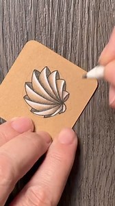 Day 6 of Summer & Sea Tangles - Phicops by Brad. 🩵 A lovely, shell-like tangle that looks complex, but it’s actually quite easy to draw. • Supplies: Micon PN pen, Faber-Castell’s Pitt Graphite Matt 10B, General’s Charcoal White, blending stumps, Gelly Roll 10 (white and blue-green). • If you want to tangle along and create your own deck of cards, you can find the real speed and narrated video on YouTube. The direct links are in highlighted stories. ✨ • #pattern #zenart #zentangle #lineart #artt