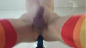 Hung twink riding suction-cup dildo on wall, moaning, with double orgasm