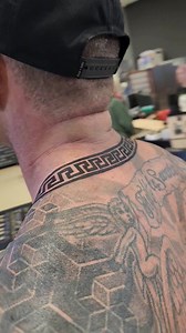 Perfectly repeating greek pattern around the neck, by Kristina | Bare Knuckle Tattoo