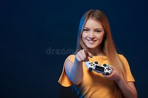 Happy Girl Holding Video Game Joystick Pointing Finger at You Stock Photo - Image of joyful, gamepad: 178448164