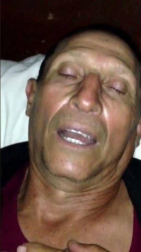 old man snoring with open mouth