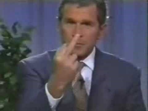 George W Bush gives one finger salute