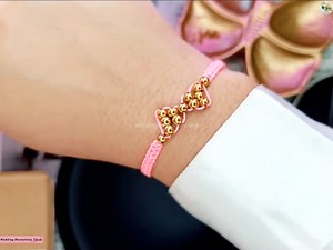 2.9K views · 29 reactions | How to make a FLAT KNOT thread bracelet with a bow design and gold beads | Wedding Decoration Ideas | Facebook