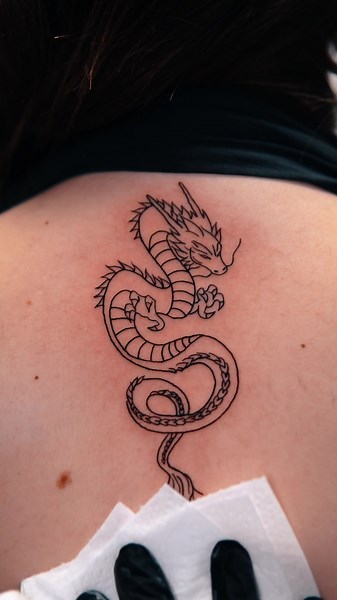 Tiny Dragon Tattoo Ideas for Minimalist Art Lovers