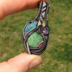 29 reactions | "Fractured Light" Available #organicmechanics #wirewrap #deepspaceedition #tourmaline #tsavorite #garnet #ruby #vesuvianite #amethyst #crystal #crystals #crystalhealing #crystalporn #pendant #pendantsofig #wrapsofig #oxidized #jewelry #jewelryporn #customjewelry #healingcrystals #handmade #ooak #art #artisan #denver #colorado #independentartist #fashion #710 | Organic Mechanics Jewelry | Facebook