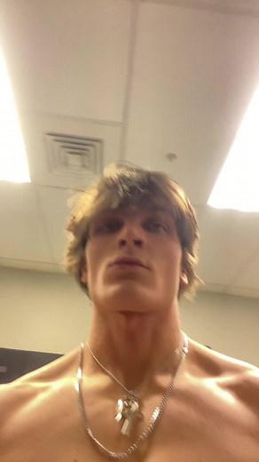 Muscular Fitness Showcase in Bright Locker Room