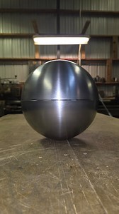 18ga cold rolled steel hemispheres becoming 10" spheres. A tricky little ring that fits inside of them holding them together and allowing a backing for the weld. Tricks from my father come in handy daily here. #metalspinning #metalart #steel #steelforming #metalartist | Northwest Metal Spinning