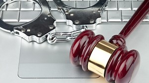 To keep classified docs from WikiLeaks secret, DOJ drops 2 child porn counts