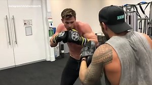 Topless Chris Hemsworth shows off boxing skills