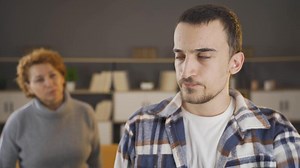Depressed teenager and his mother.