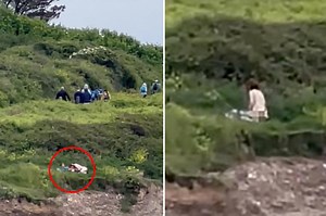 Shocking moment couple romps on cliff