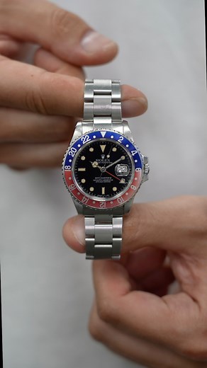 A Rolex GMT-Master II (ref. 16760) ‘Fat Lady’ with a unique dial! Released in 1983 the 16760 was the very first GMT-Master II, debuting both the independent hour hand and quickset date. Nicknamed the “Fat Lady” for its notably thicker case and crown guards, it also introduced the now-classic red and black “Coke” bezel — though this example wears a rare period-correct red and blue “Pepsi” insert. The watch runs on the upgraded Calibre 3085 and features a glossy black dial with white gold surround