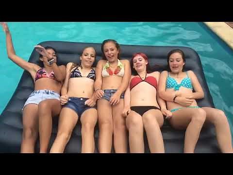 Clipondra bikini jewelry on teenage girls playing in the swimming pool. Kicking and splashing fun.