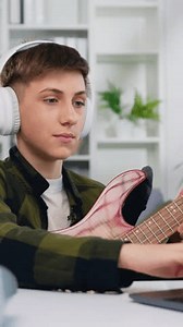 Attaractive Boy Headphone Learning Play Guitar Stock Footage Video (100% Royalty-free) 3976779463 | Shutterstock