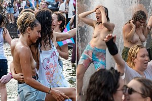 Topless women splash in fountains for New York City's annual Dyke March