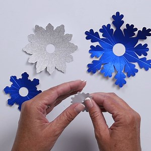 Let it snow—on your tree! Craft paper snowflakes with this free SVG and shine bright. ❄️ | The Crafty Blog Stalker