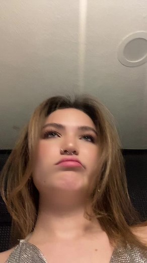 Expressive Dance in Shiny Metallic Outfit