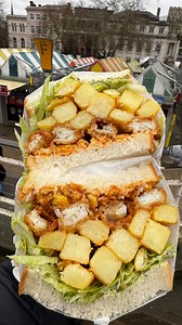 I love it when @bodega175_norwich launch a new sandwich, gotta try them all right! The new Chippy Tea sandwich (£9) has a stack of cod fish fingers and curry spiced curry chips w/ vinegar, cheddar, pea and mint mayo, crispy bits and lettuce between white sliced bread. A magnificent combo and beautiful cross section as always by these guys. The weather may be a bit grim at the moment but this will definitely brighten up your day. #fryupinspector #chippytea #norwichmarket #food #streetfood | Fry U