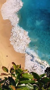 Kelingking Beach in Nusa Penida, Bali, Indonesia is a real-life dream. The way the waves gently embrace the untouched sands looks almost unbelievably beautiful. Every sight and sound here is like a soft, dreamy whisper. If you've ever wondered about the beauty of nature, this beach will make you a true believer.  Location: Kelingking Beach, Nusa Penida Captured by: @wiradimassatrio. . . . #wonderfulindonesia #baliindonesia #explorebali #traveladdict | Banda Bags | Facebook