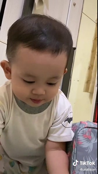 Adorable Toddler Playing at Home in Batman T-Shirt