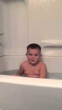 Kid falling asleep in bathtub
