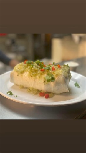 Enjoy our famous pineapple jerk chicken burrito with a blood orange margarita today! Parking Meters are FREE anytime on Sundays & after 6pm the other 6 days! 💃 Order pickup/delivery at #ragingburrito.com or delivery through Door Dash! 🎉 | Raging Burrito & Taco