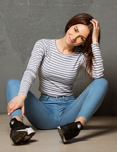 Brunette Woman Sitting with Spread Legs in Striped Shirt Rare Gallery wallpaper