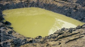 Recent dig dugout, fire extinction basin. Sandy-silty soil and troubled coffee with milk waters
