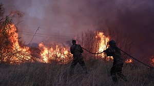 Wildfire spreads near Athens amid scorching heat, prompting evacuations