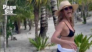 Jennifer Aniston shows off her fit figure in a black bikini during vacation with Jimmy Kimmel, Jason Bateman
