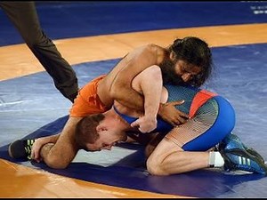 Baba Ramdev beats Olympic medalist in promotional wrestling bout