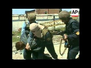 Chechnya - Russian Forces Disarm Grozny Rebels