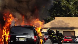 Minivan taxi catches fire while driving in Ridgewood