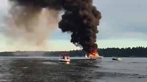 2 jump into Lake Washington to escape burning boat