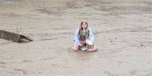 Maryland flash flooding prompts rescue of hundreds of students trapped in school by rising waters