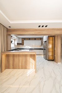 13K views · 44 reactions | Can a Cashmere Kitchen Feel Like a Masterpiece? A cashmere-finished kitchen meets natural wood textures, The double-height bar adds a striking focal point, perfect for gathering, dining, and making memories.  Visit our showroom and bring your vision to life. #StovaKitchens #TimelessDesign #KitchenInspiration | Stova kitchens | Facebook