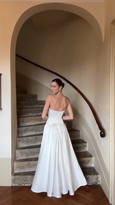 25K views · 30 reactions | Our muse Danielle Copperman Sersoub looks so stunning in this silk dress ✨ A perfect blend of elegance and femininity, this design features a softly structured corset with hidden boning for a flawless silhouette. The flowing silk skirt, delicately pleated, adds a touch of romance and grace to every movement. Simple yet sophisticated, this gown is the epitome of timeless beauty. #huongboutique #lovehuong #feedback | HUONG Boutique | Facebook