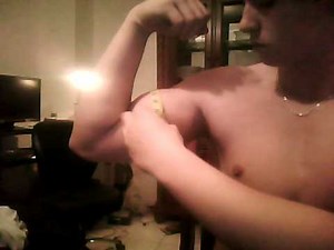 15 year old bodybuilder flexing and measuring bicep