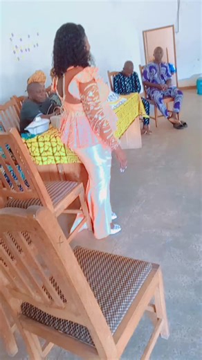 Peach-Colored Dress with Golden Details in Traditional Gathering